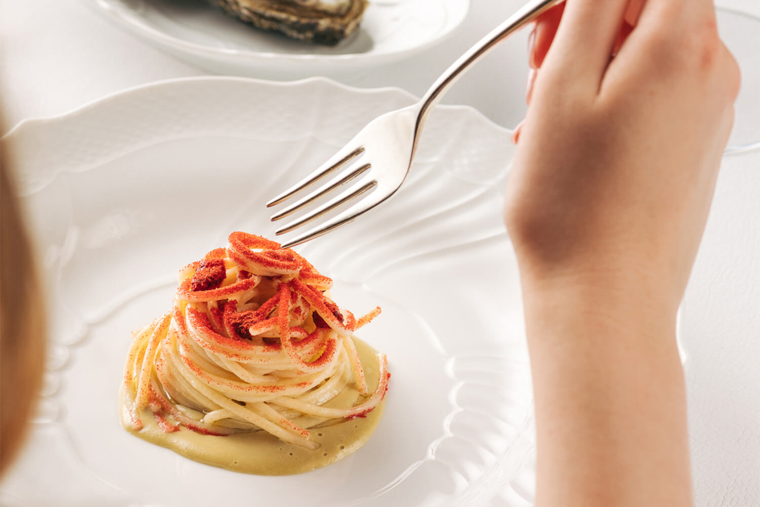 Foto professionale di un piatto di alta ristorazione al ristorante stellato Gellius